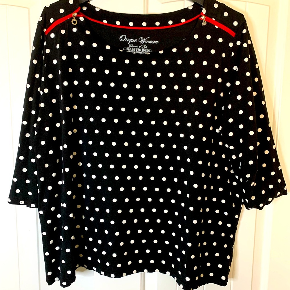 Black shirt with white polka dots.